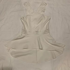 Bebe ivory peplum with lace crisscross neck top XS